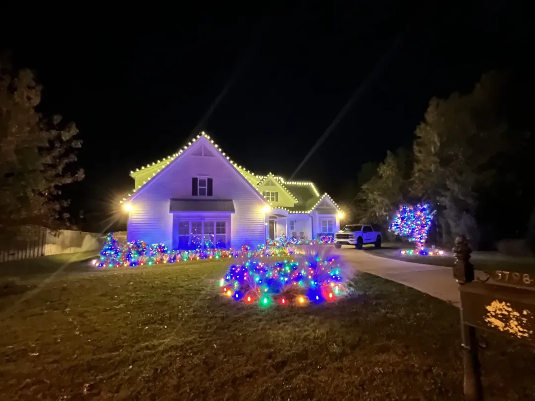 Holiday light display across a suburban home
