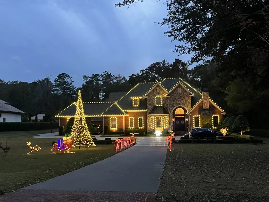 Full home Christmas lighting at dusk